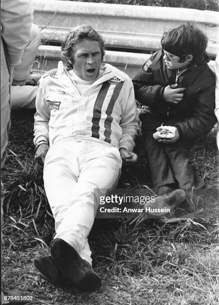 Actor Steve McQueen relaxes with his son Chad as he stars in the movie 'Le Mans' on June 24, 1971 in Le Mans, France