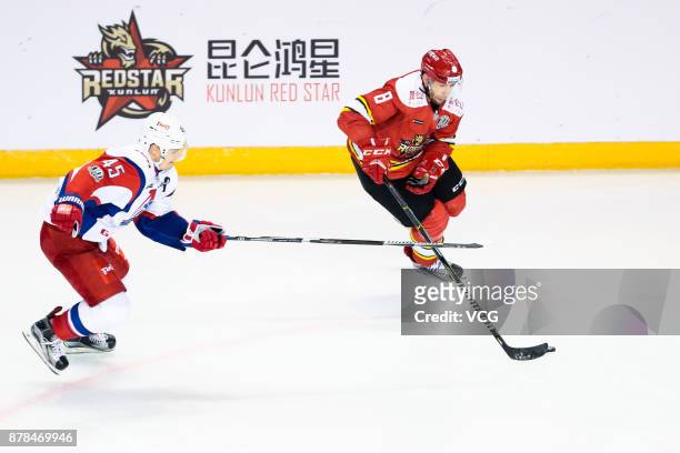 Wojtek Wolski of HC Kunlun Red Star and Alexander Kutuzov of Lokomotiv Yaroslavl vie for the puck during the 2017/18 Kontinental Hockey League...