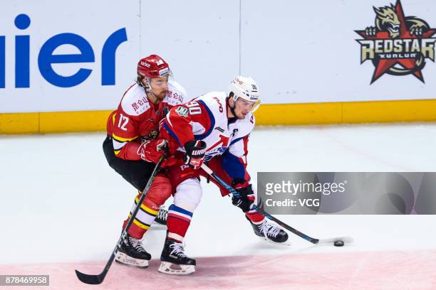 Andreas Thuresson of HC Kunlun Red Star and Andrei Loktionov of Lokomotiv Yaroslavl vie for the puck during the 2017/18 Kontinental Hockey League...
