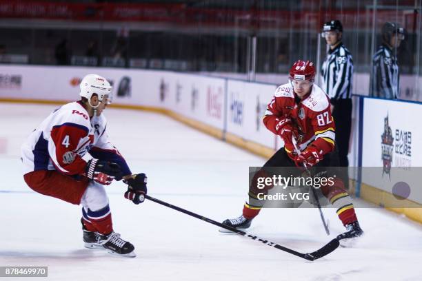 Jaakko Rissanen of HC Kunlun Red Star and Alexander Yelesin of Lokomotiv Yaroslavl vie for the puck during the 2017/18 Kontinental Hockey League...