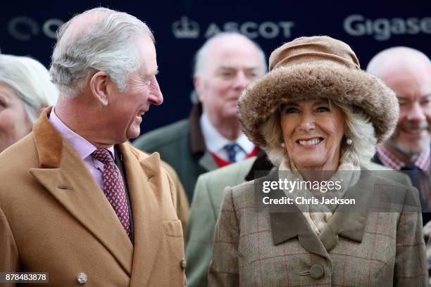 Prince Charles, Prince of Wales and Camilla, Duchess of Cornwall present the award for The Waitrose Handicap Steeple Chase to The George Inn Racing...
