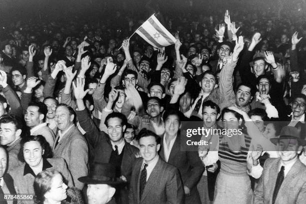 This 29 November 1947 photo taken in Tel Aviv shows residents celebrating the UN deicision to create a Jewish state by dividing Palestine into two...