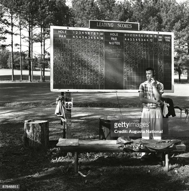 1950s: A scoreboard operator during a 1950s Masters Tournament at Augusta National Golf Club in Augusta, Georgia.