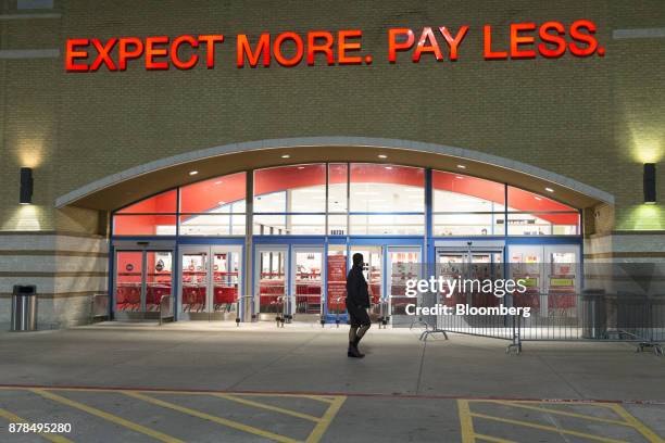 Man passes in front of a Target Corp. Store on Black Friday in Dallas, Texas, on Friday, Nov. 24, 2017. The National Retail Federation projects that...