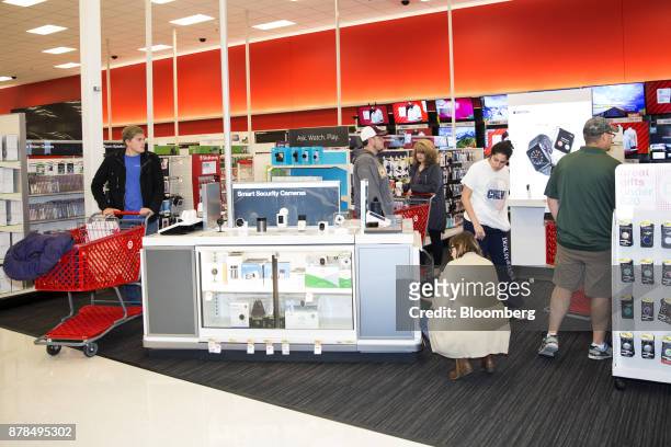 Shoppers view electronics displayed for sale at a Target Corp. Store on Black Friday in Dallas, Texas, on Friday, Nov. 24, 2017. The National Retail...