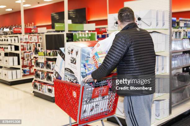 Shopper passes in front of the electronics section at a Target Corp. Store on Black Friday in Dallas, Texas, on Friday, Nov. 24, 2017. The National...