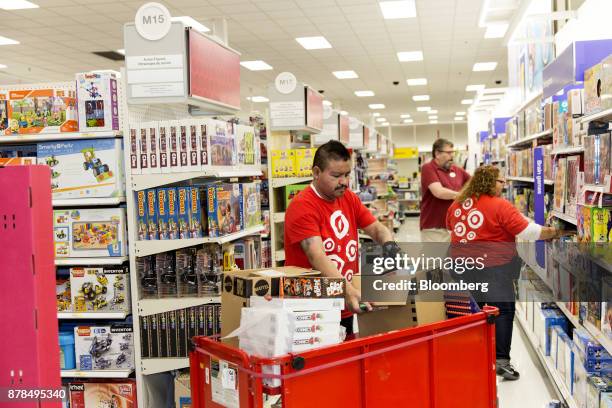 Employees restock toys at a Target Corp. Store on Black Friday in Dallas, Texas, on Friday, Nov. 24, 2017. The National Retail Federation projects...