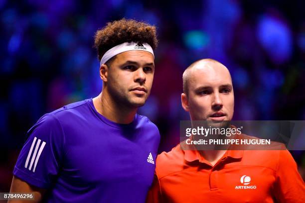France's Jo-Wilfried Tsonga poses with Belgium's Steve Darcis during the Davis Cup World Group singles rubber final tennis match between France and...