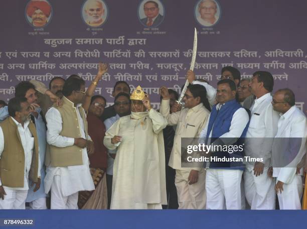 Bahujan Samaj Party workers presenting golden crown to party president Mayawati during state level party workers meeting, on November 24, 2017 in...