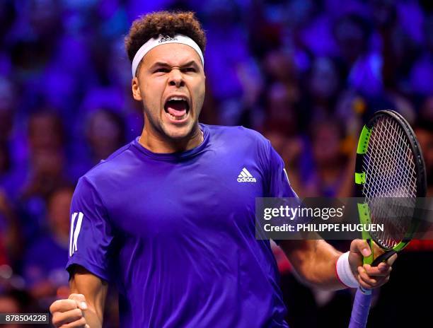 France's Jo-Wilfried Tsonga reacts after winning a point against Belgium's Steve Darcis during the Davis Cup World Group singles rubber final tennis...