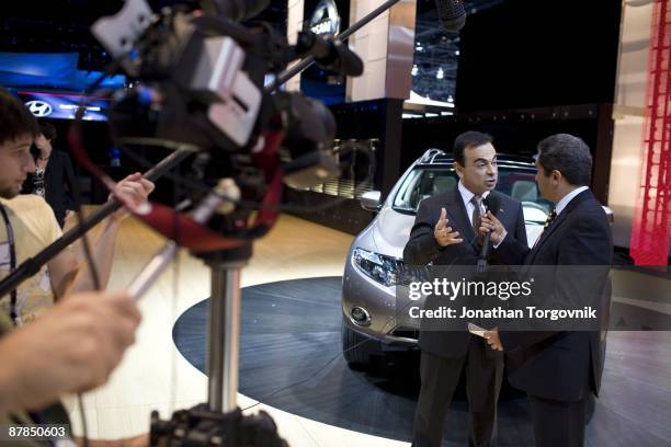 Carlos Ghosn, CEO of Nissan and Renault is intreviewed by TV media at the Los Angeles auto show November 14, 2007 in Los Angeles, California.