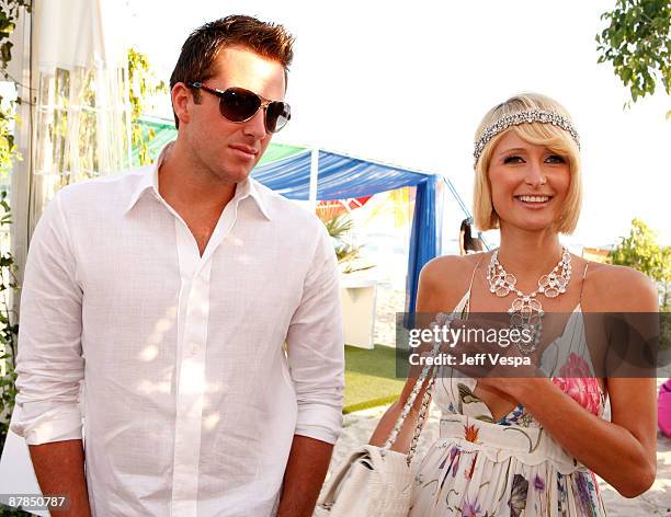 Paris Hilton and Doug Reinhardt attend the Paris Not France Cocktail Party at la plage vitaminwater during the 62nd Annual Cannes Film Festival on...