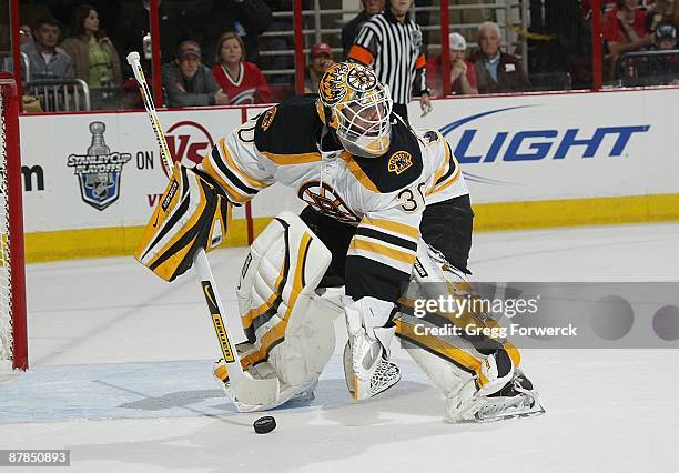 Tim Thomas of the Boston Bruins comes out of the crease to play the puck during Game Three of the Eastern Conference Semifinal Round of the 2009...