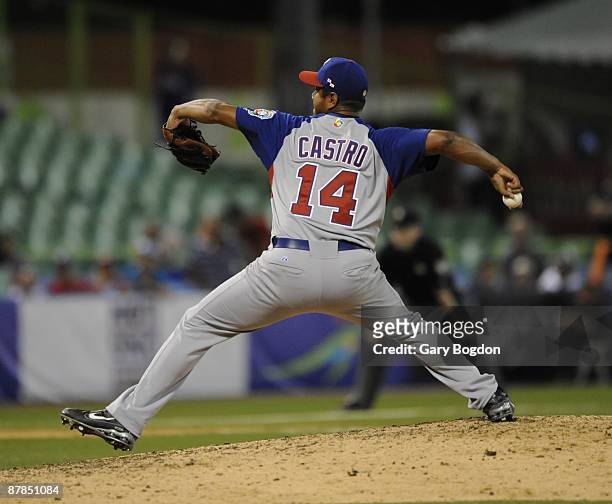 Panama pitcher Yeliar Castro winds up off the mound during the Pool D, game three between the Dominican Republic and Panama during the the first...