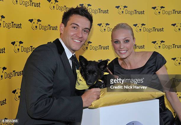 Actor Kevin Sacre and professional dancer Camilla Dallerup pose with Fluffles the dog during the Dogs Trust Honours 2009 at The Hurlingham Club on...