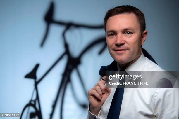 President of the Union Cycliste Internationale , David Lappartient poses during a photo session on November 23, 2017 in Paris. / AFP PHOTO / FRANCK...