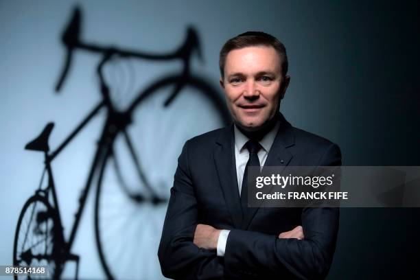 President of the Union Cycliste Internationale , David Lappartient poses during a photo session on November 23, 2017 in Paris. / AFP PHOTO / FRANCK...