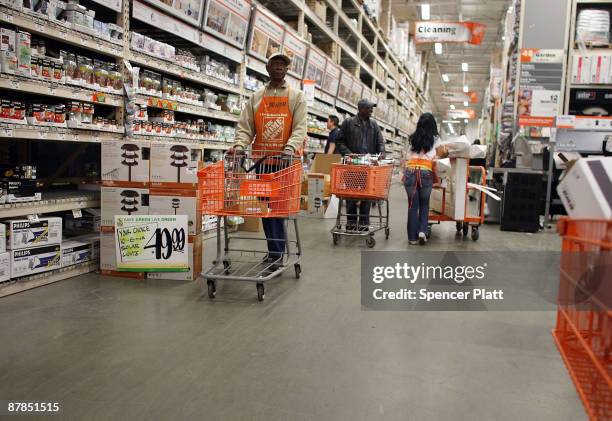 People shop at a Home Depot store May 19, 2009 in Brooklyn borough of New York City. Home Depot, the country�s largest home improvement retailer,...