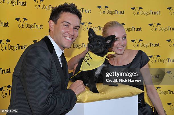 Actor Kevin Sacre and professional dancer Camilla Dallerup pose with Fluffles the dog during the Dogs Trust Honours 2009 at The Hurlingham Club on...