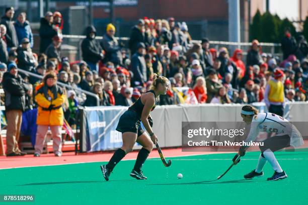 Bodil Keus of the University of Maryland moves the ball past Charlotte Veitner of the University of Connecticut during the Division I Women's Field...