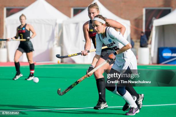 Charlotte Veitner of the University of Connecticut and Bodil Keus of the University of Maryland chase a loose ball during the Division I Women's...