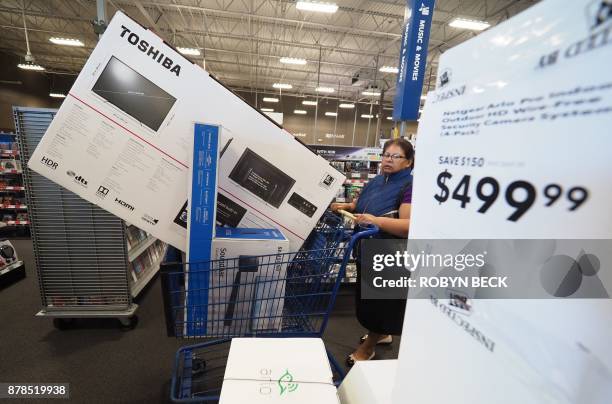 Consumers shop Black Friday sales at the Best Buy store in Burbank, California, November 24, 2017 near Los Angeles. More than 164 million Americans...