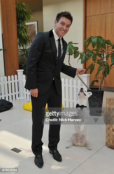 Actor Kevin Sacre poses with Sven the dog during the Dogs Trust Honours 2009 at The Hurlingham Club on May 19, 2009 in London, England.