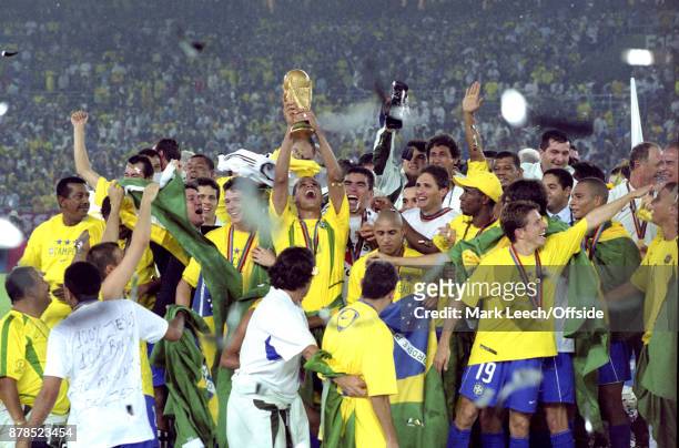 June 2002 Yokohama : FIFA World Cup Final - Brazil v Germany : Rivaldo holds the trophy aloft for Brazil