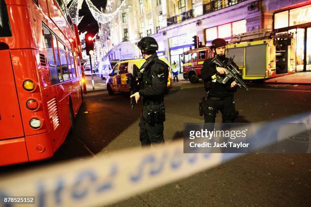 Armed Police officers are seen near Oxford Circus underground station on November 24, 2017 in London, England. Police are responding to reports of an...