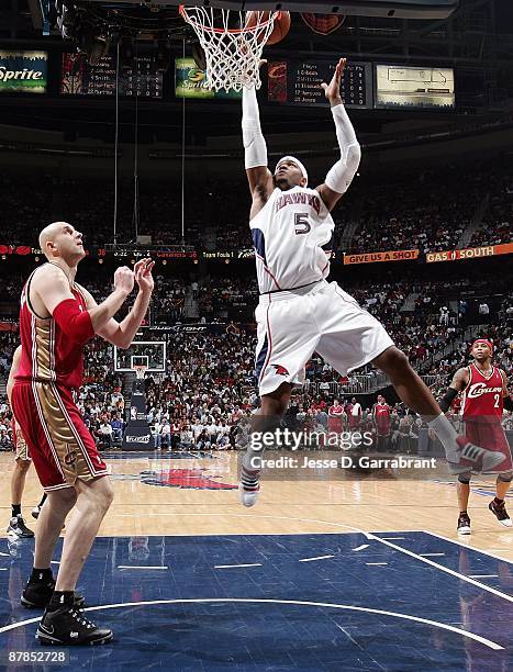 Joe Johnson of the Atlanta Hawks goes to the basket against Zydrunas Ilgauskas of the Cleveland Cavaliers in Game Three of the Eastern Conference...