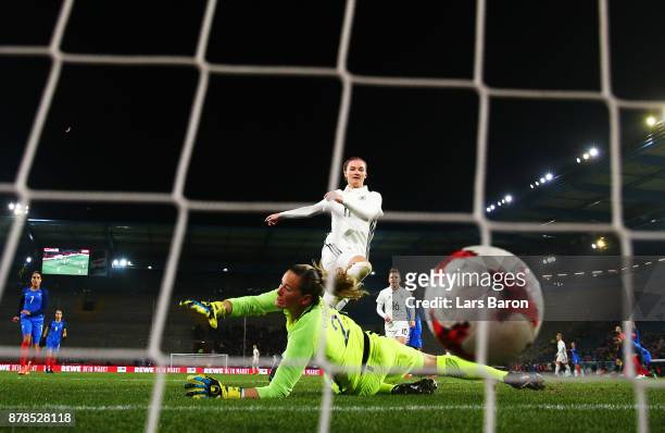Alexandra Popp of Germany scores the third goal past Meline Gerard of France during the Germany v France Women's International Friendly match at...
