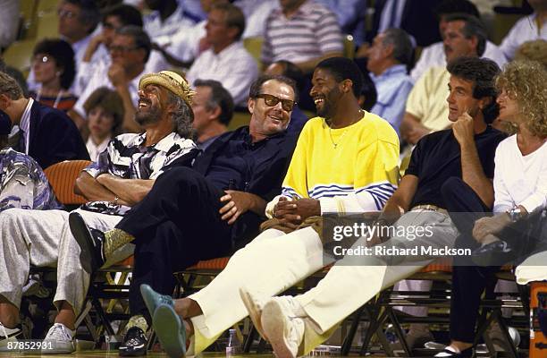 Finals: Los Angeles Lakers fan and celebrity actor Jack Nicholson with producer Lou Adler with former player Norm Nixon in stands during Game 2 vs...