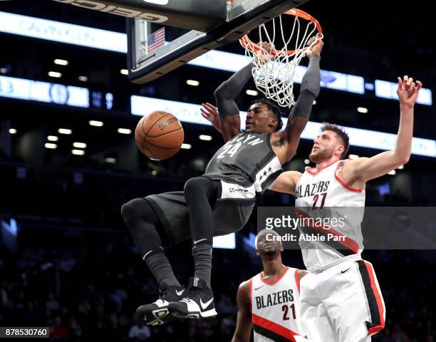 Rondae Hollis-Jefferson of the Brooklyn Nets dunks the ball against Jusuf Nurkic of the Portland Trail Blazers in the first quarter at Barclays...