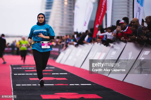 Competitors react as they finish IronGirl race ahead of IRONMAN 70.3 Middle East Championship Bahrain on November 24, 2017 in Bahrain, Bahrain.