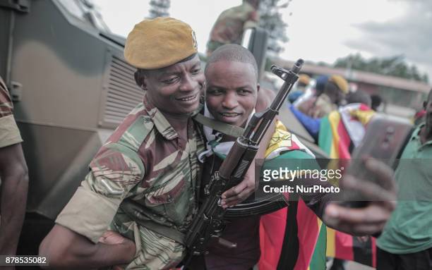 Zimbabwean man takes photo with military during inauguration of new president Emmerson Mnangagwa at Harare International Stadium People in Harare on...
