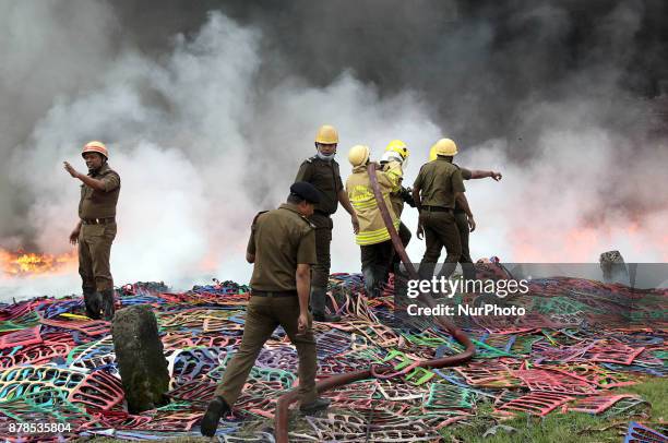 Firefighters try to douse a fire that broke out in a footwear factory at a residential area in Kolkata, India, November 24, 2017.