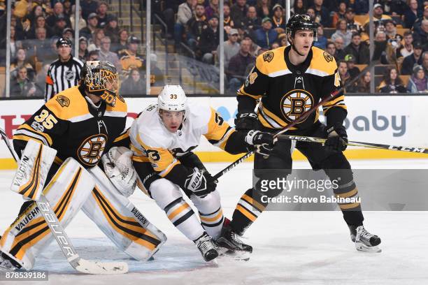 Greg McKegg of the Pittsburgh Penguins against Anton Khudobin and Rob O'Gara of the Boston Bruins at the TD Garden on November 24, 2017 in Boston,...