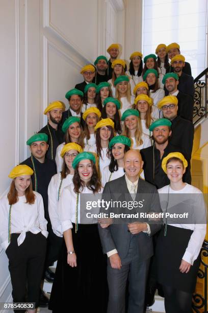 Stephen Jones, hat designer for Christian Dior fashion house, poses with Catherinettes and Nicolas during Dior celebrates Sainte-Catherine at Dior...