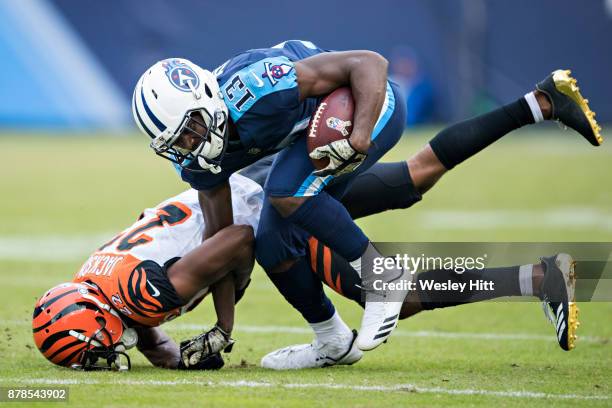 Taywan Taylor of the Tennessee Titans is tackled by William Jackson of the Cincinnati Bengals at Nissan Stadium on November 12, 2017 in Nashville,...