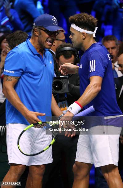 Jo-Wilfried Tsonga of France celebrates with his captain Yannick Noah his victory against Steve Darcis of Belgium during day 1 of the Davis Cup World...