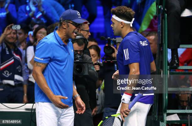 Jo-Wilfried Tsonga of France celebrates with his captain Yannick Noah his victory against Steve Darcis of Belgium during day 1 of the Davis Cup World...