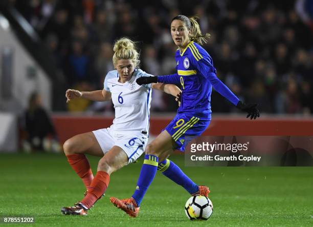 Milena Nikolic of Bosnia and Herzegovina holds off Millie Bright of England during the FIFA Women's World Cup Qualifier between England and Bosnia...