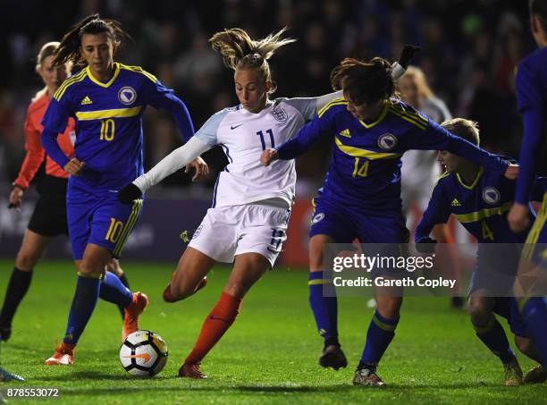 Toni Duggan of England is blocked by Dajana Spasojevic of Bosnia and Herzegovina during the FIFA Women's World Cup Qualifier between England and...