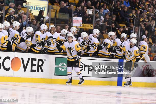 Jake Guentzel and Kris Letang of the Pittsburgh Penguins celebrate a goal in the second period against the Boston Bruins at the TD Garden on November...