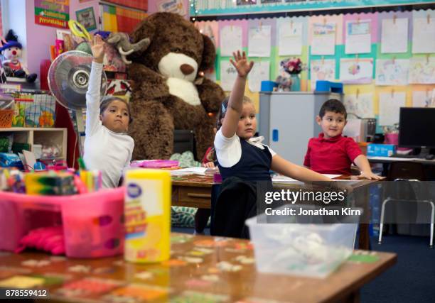 students at catholic school. - electric fan paper stock pictures, royalty-free photos & images