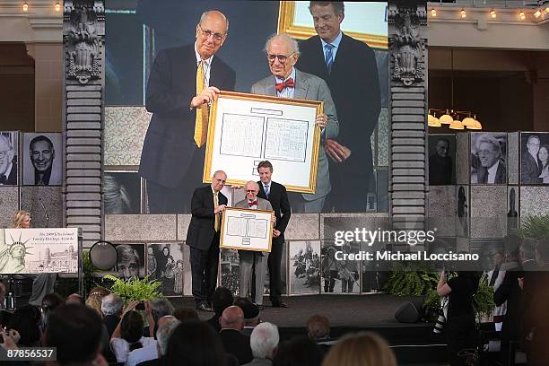 Dr. Eric R. Kandel is honored by honored by President and CEO of Liberty-Ellis Island Foundation, Inc. Stephan Briganti and Assistant Secretary of...
