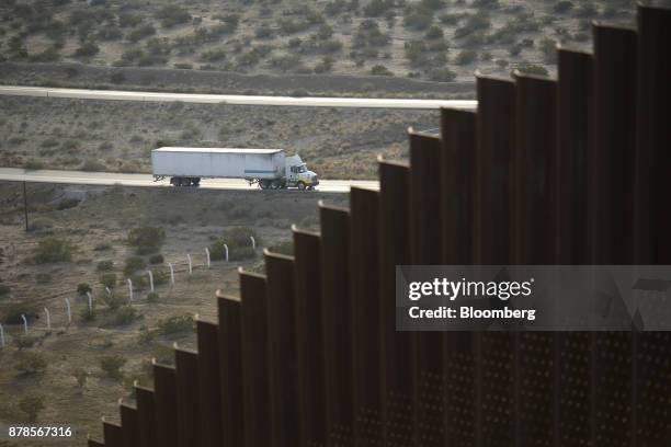 Truck drives along a road in Juarez, Mexico, near a border fence that separates the U.S. And Mexico in Sunland Park, New Mexico, U.S., on Wednesday,...