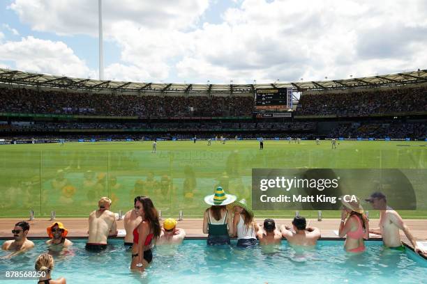 Fans enjoy the pool deck during day two of the First Test Match of the 2017/18 Ashes Series between Australia and England at The Gabba on November...