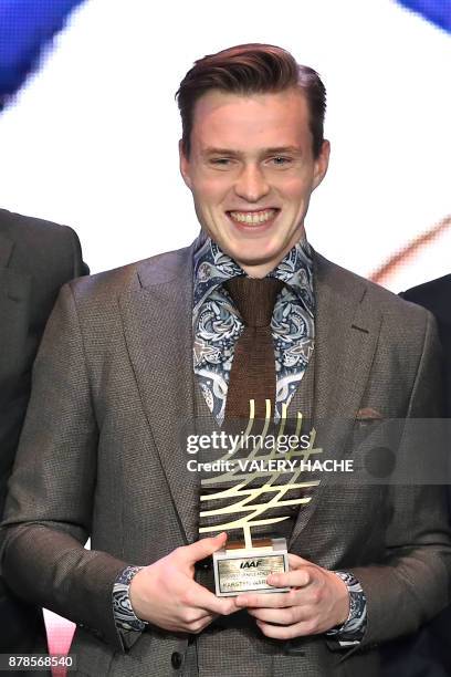 400m hurdles champion Norway's Karsten Warholm poses with the trophy after being awarded Male Rising Star of the Year 2017 during the International...