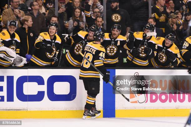 Matt Grzelcyk of the Boston Bruins celebrates his first NHL goal in the second period against the Pittsburgh Penguins at the TD Garden on November...